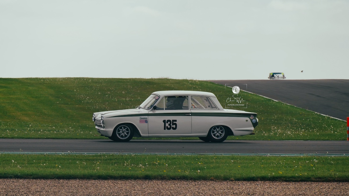 Reynolds/Quintero (#135) driving a Ford Lotus Cortina in the Under 2 Litre Touring Car category