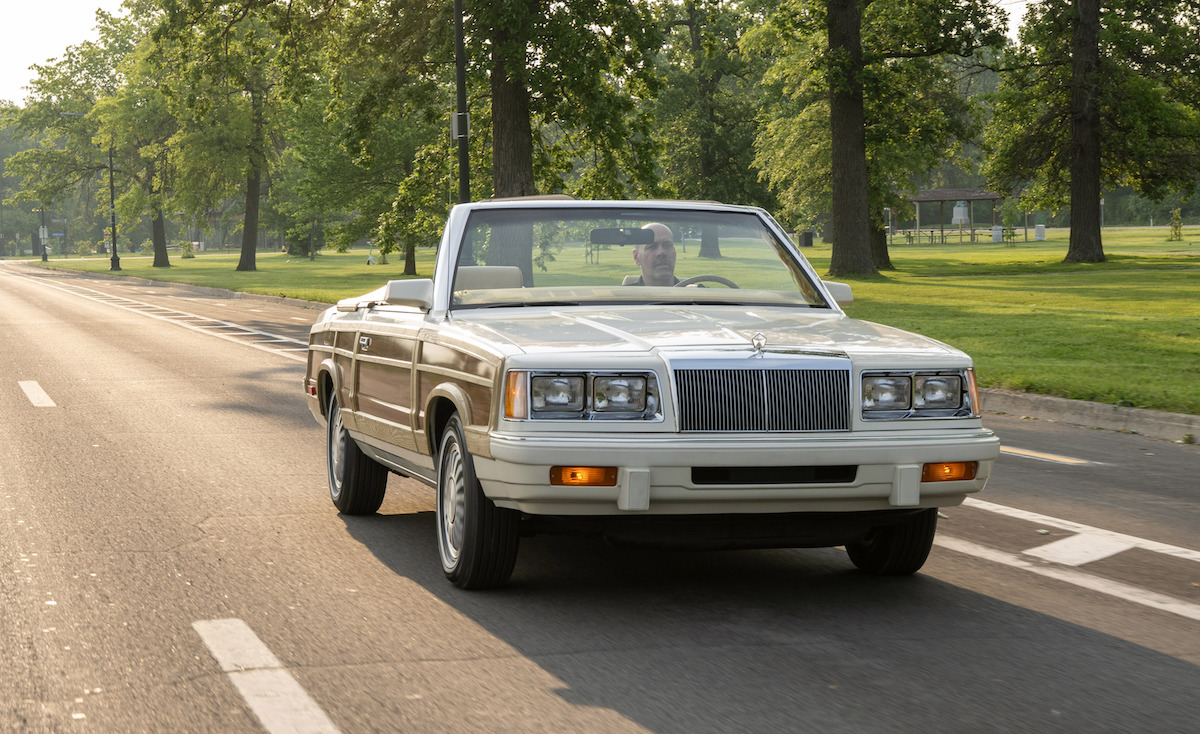 Chrysler is celebrating 100 years, and the brand kicked off its birthday week celebration on June 4, 2025, by giving media the once-in-a-century opportunity to drive historic Chrysler vehicles, including the 1986 Chrysler LeBaron Town & Country Convertible, on Detroit’s Belle Isle.