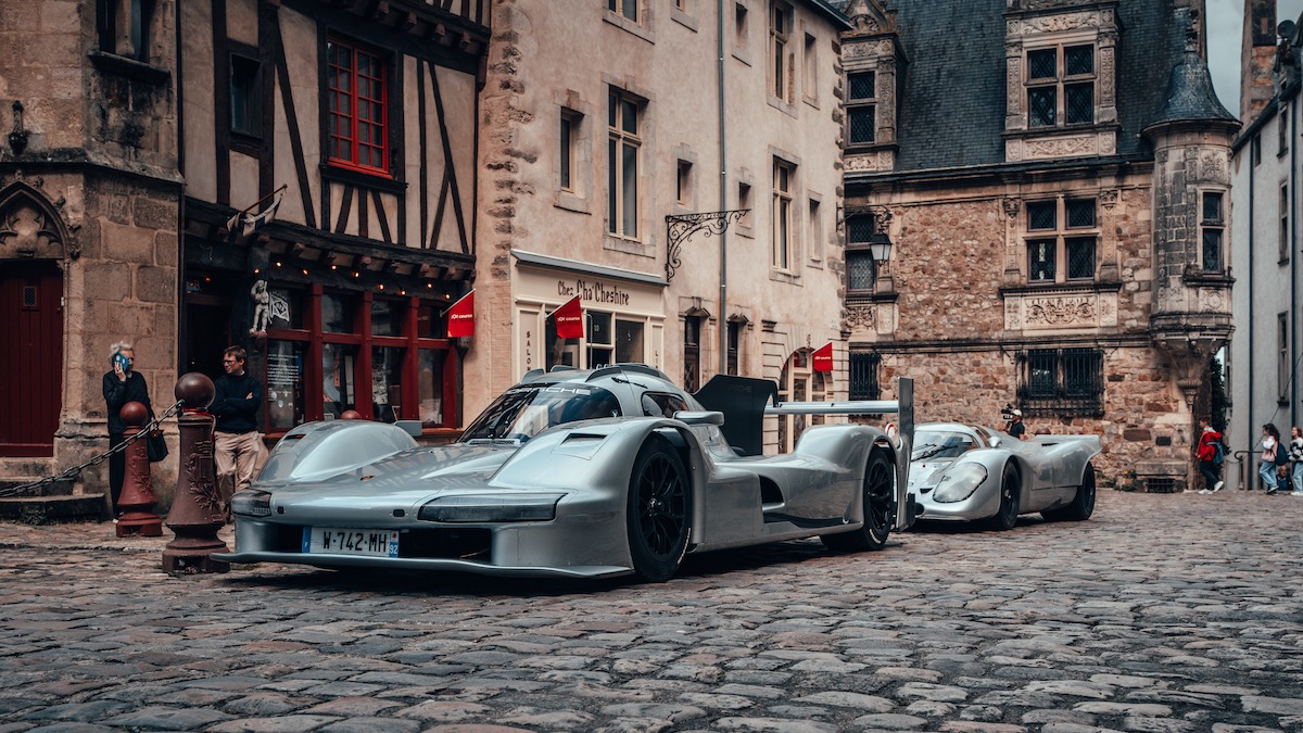 Porsche 963 RSP and Count Rossi 917 parked in front of old French buildings