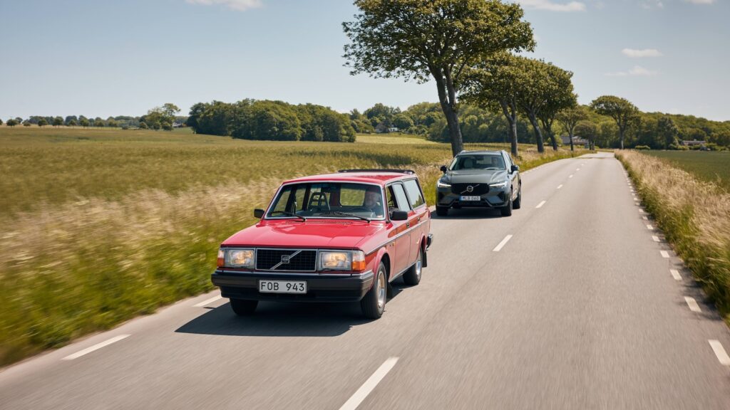 Volvo 240 and XC60 driving down country road