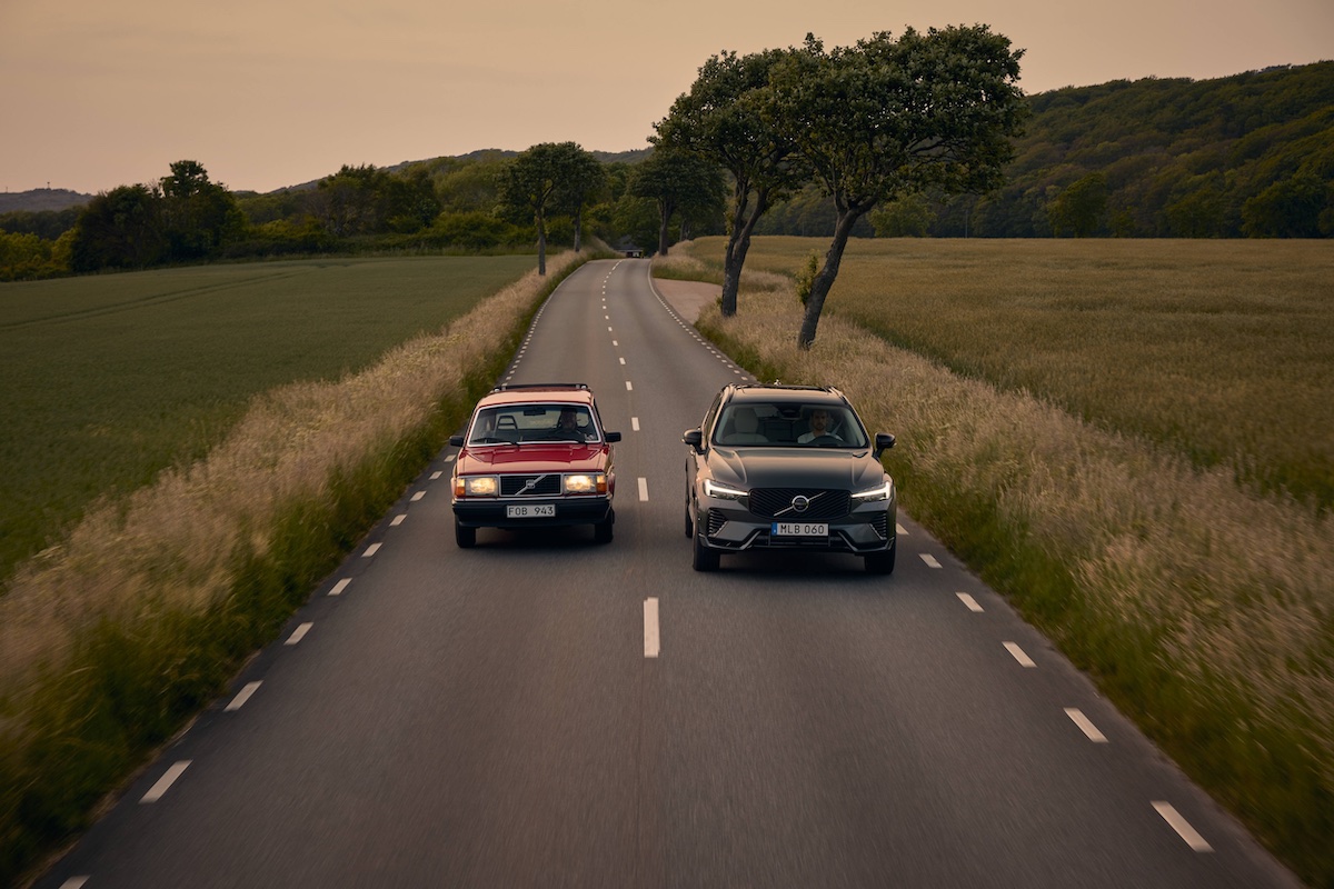 Volvo 240 and XC60 driving down country road