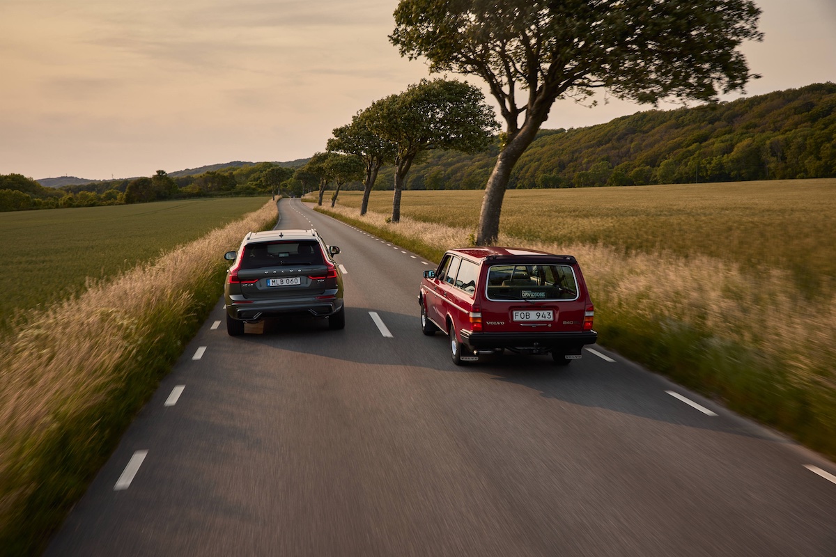 Volvo 240 and XC60 driving down country road