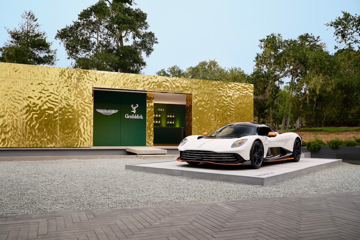 Aston Martin Valhalla next to the Glenfidditch whiskey display at Monterey Car Week 2025