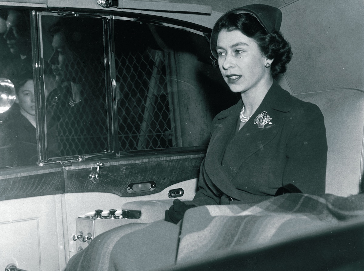 Queen Elizabeth II in the back of a Rolls-Royce Phantom IV Landaulette