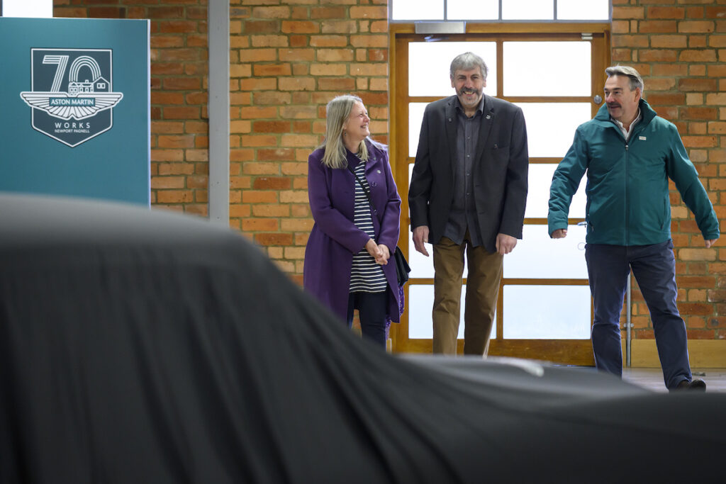 Mr and Mrs Williams with Paul Spires, President of Aston Martin Works, at the unveiling of their restored DB5 Vantage