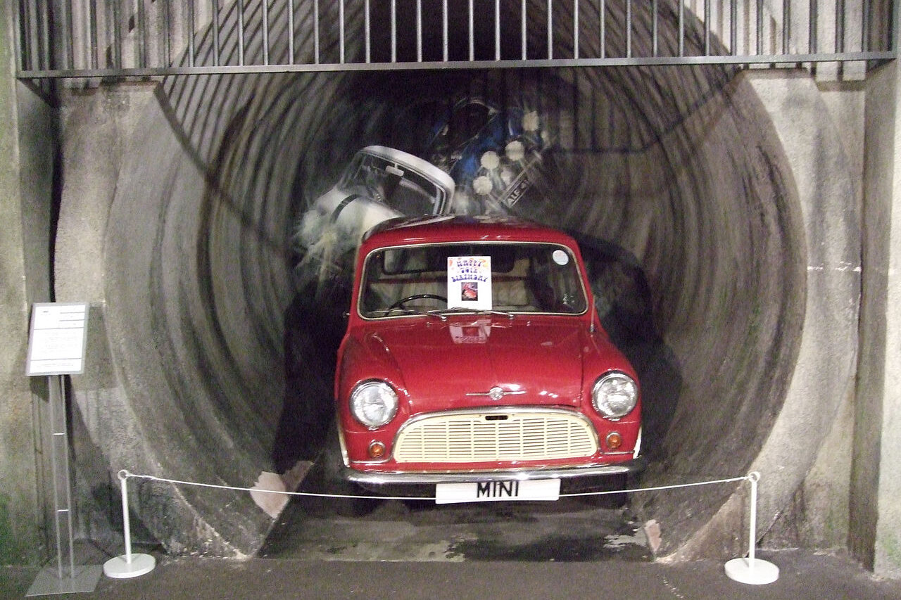 A Mini emerging from a tunnel, representing one of the most famous chase scenes from the iconic movie 'The Italian Job', filmed in Coventry's sewers as the sewers in Milan were too small.