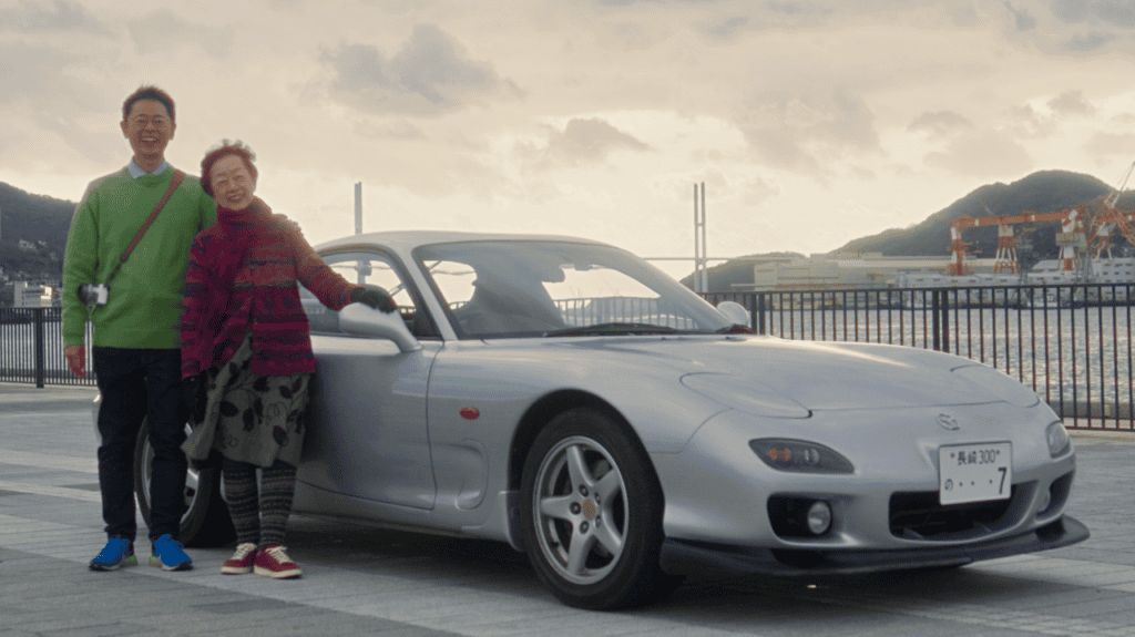 Makota and Naoko Nishimoto with Naoko's Mazda RX-7