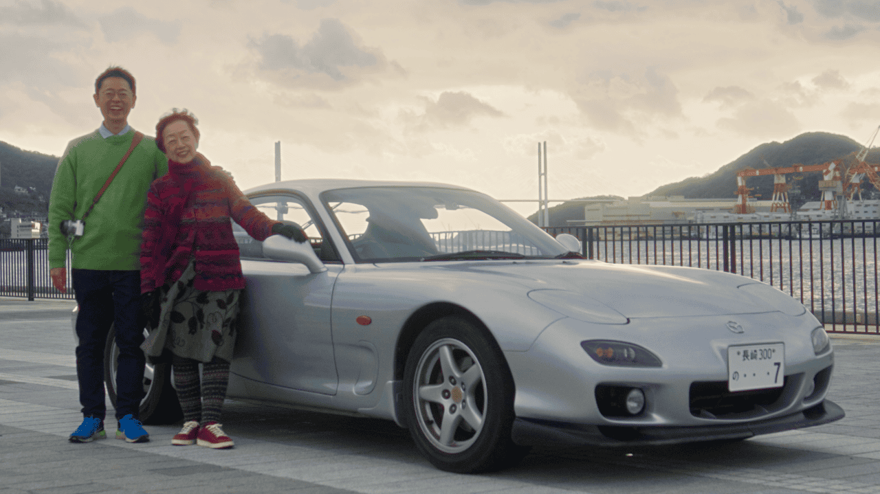 Makota and Naoko Nishimoto with Naoko's Mazda RX-7