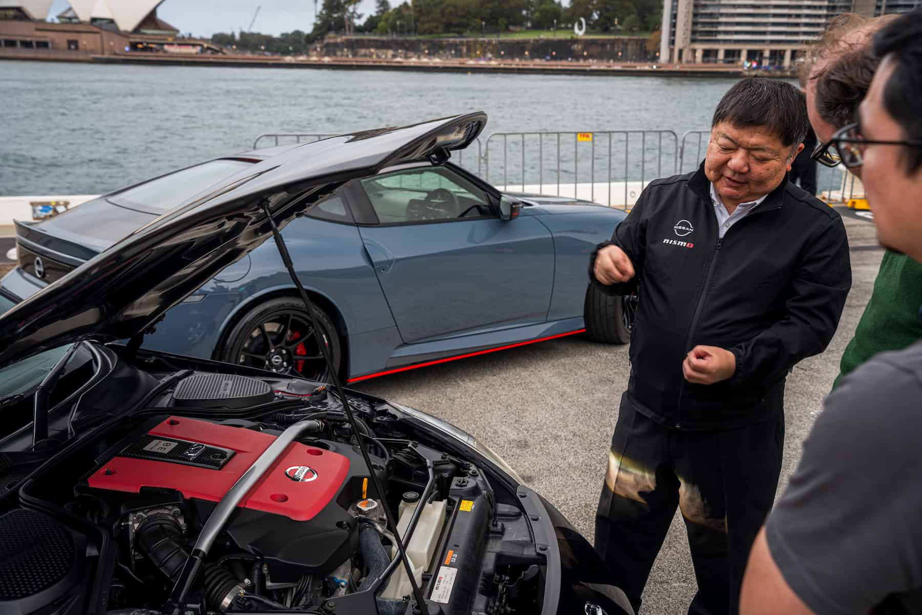 Yutaka Sanada talking to journalists about the Nismo 380RS