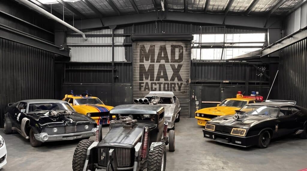 Officially licensed Mad Max vehicles at the Mad Max Factory in Australia, where screen‑accurate recreations are built by hand to preserve the raw mechanical language of George Miller and Doug Mitchell’s iconic cinematic world.