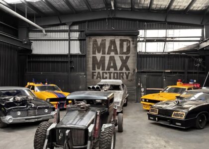 Officially licensed Mad Max vehicles at the Mad Max Factory in Australia, where screen‑accurate recreations are built by hand to preserve the raw mechanical language of George Miller and Doug Mitchell’s iconic cinematic world.