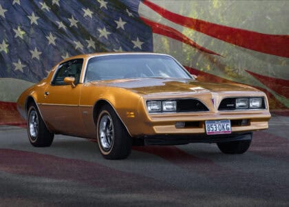 1978 Pontiac Firebird with USA flag in background