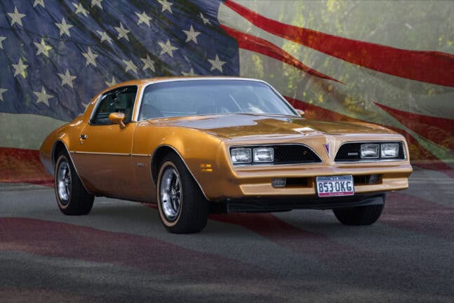 1978 Pontiac Firebird with USA flag in background