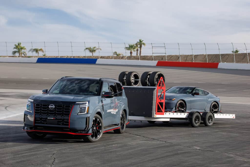 2026 Nissan Armada NISMO towing a Z