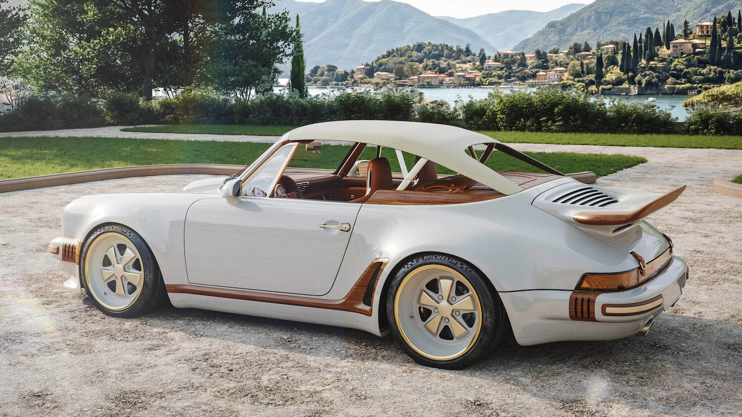 Side exterior profile - presented in Calcaire Lutétien White with wood accents Whale tail rear spoiler and lightweight canvas roof in the raised position