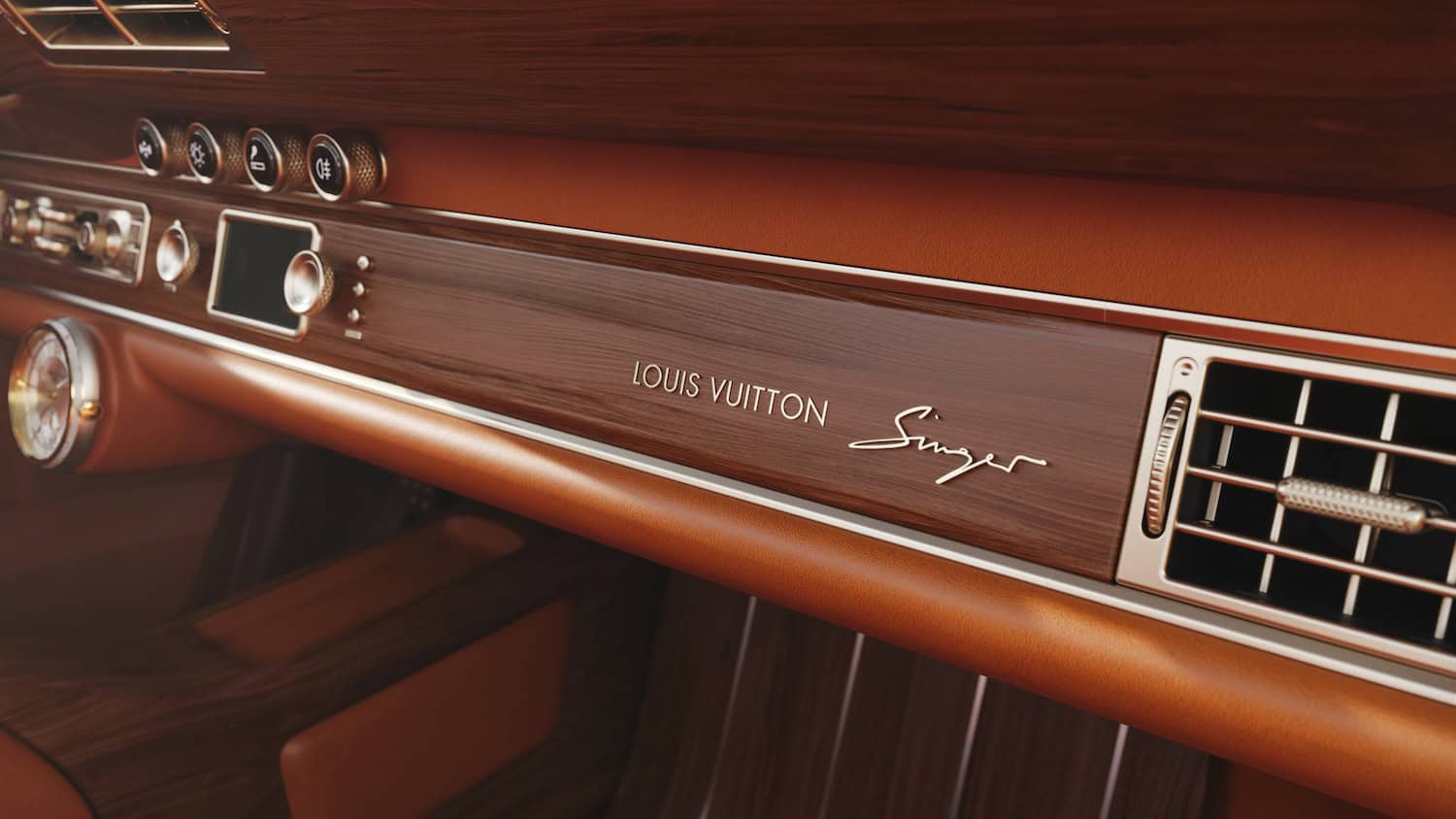 Interior detail showing wood dash strip with gold Louis Vuitton and Singer emblems