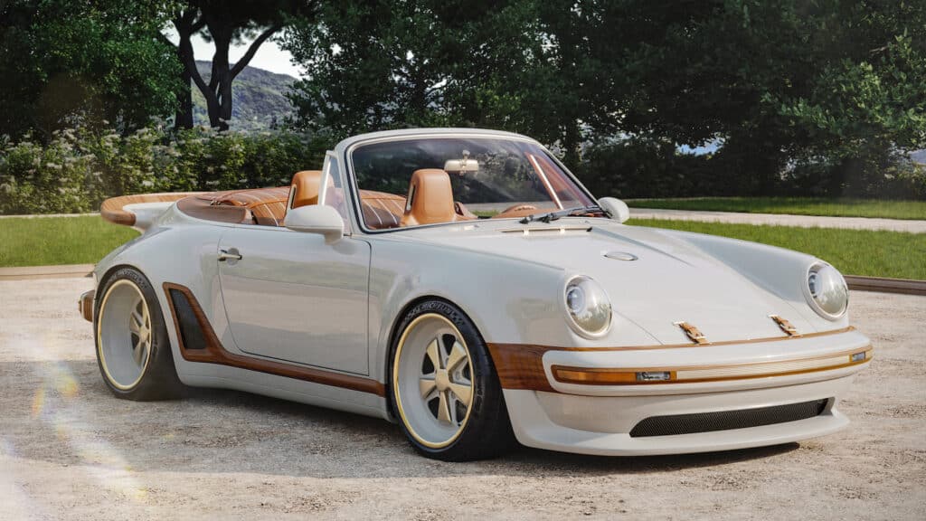 Front ¾ view with roof lowered, showing carbon fibre bodywork in Calcaire Lutétien White with wood accents incorporated into front bumper, side rocker panels, rear luggage compartment and rear spoiler.