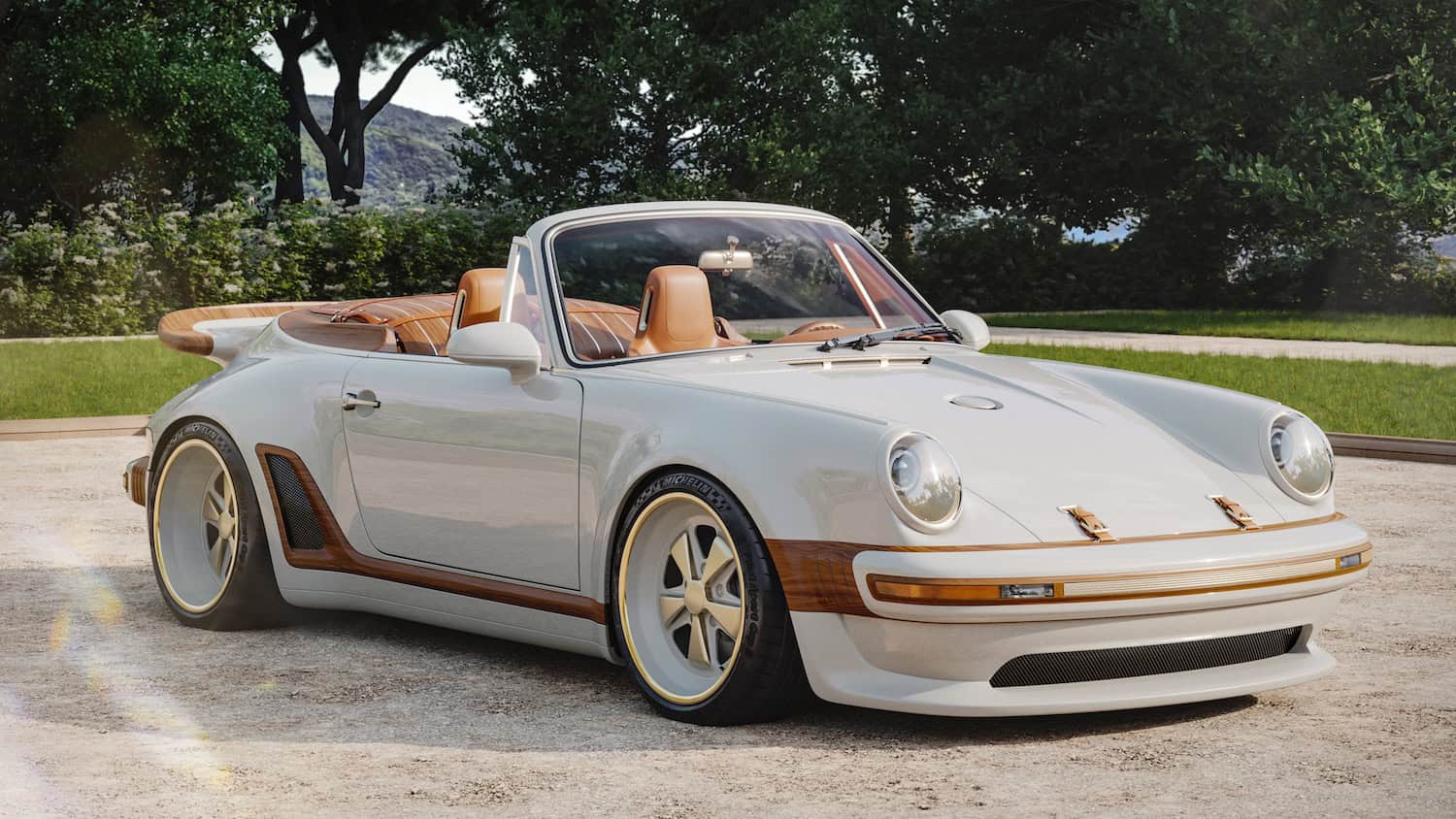 Front ¾ view with roof lowered, showing carbon fibre bodywork in Calcaire Lutétien White with wood accents incorporated into front bumper, side rocker panels, rear luggage compartment and rear spoiler.