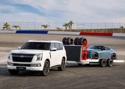 Nissan Patrol towing a trailer with a Z on the back