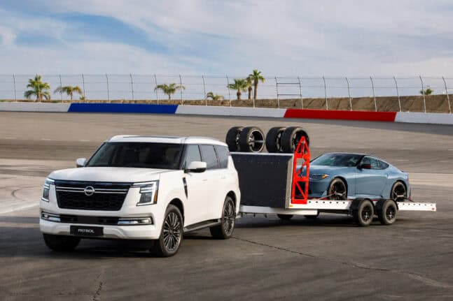 Nissan Patrol towing a trailer with a Z on the back